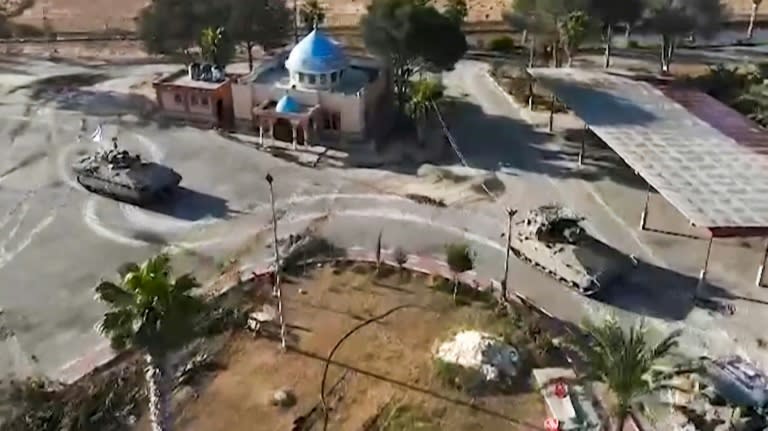 In this image grab from video released by the army, Israeli tanks are seen entering the Palestinian side of the Rafah border crossing between Egypt and Gaza, the main entry point for aid deliveries to the besieged territory (Fayez Nureldine)