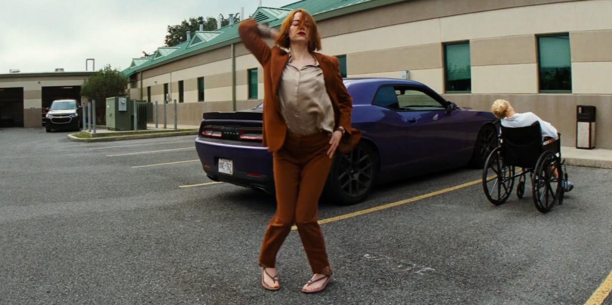 a person walking in a parking lot