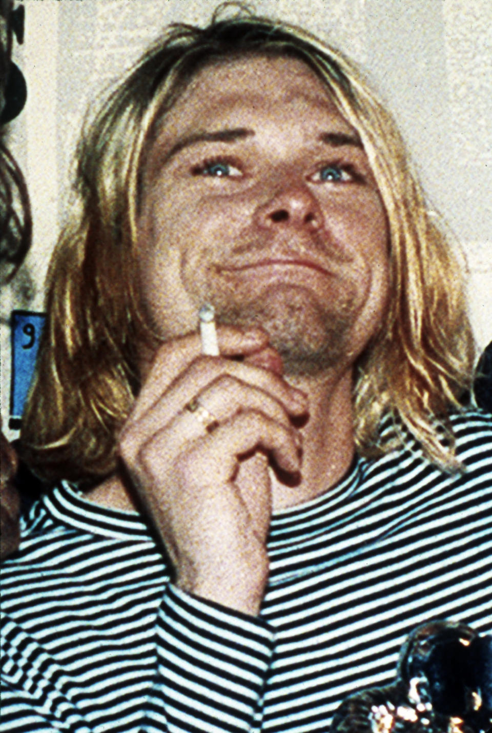 FILE - This 1993 file photo shows Kurt Cobain, lead singer of Nirvana. A handwritten note police discovered in Kurt Cobain's wallet after his suicide disparages his wife Courtney Love. CBS News reports Wednesday, April 30, 2014, that the note was taken from Cobain's wallet when police arrived at his home on April 8, 1994, after Cobain fatally shot himself. The note was never made public. CBS obtained it from the Seattle Police via a public information request. The network reports that the undated note, apparently written by Cobain on stationery from San Francisco's Phoenix Hotel, is written like a mock wedding vow. It references Love as Cobain's "lawful shredded wife" who would be "siphoning" his money for drugs. (AP Photo/Mark J.Terrill, File)