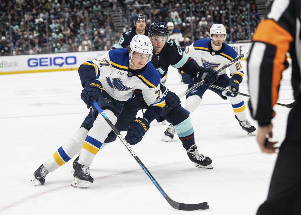 FILE - St. Louis Blues defenseman Niko Mikkola, left, works against Seattle Kraken defenseman Vince Dunn during the third period of an NHL hockey game Tuesday, Dec. 20, 2022, in Seattle. The New York Rangers have acquired Vladimir Tarasenko and depth defenseman Niko Mikkola from the Blues, in a deal that sent conditional 2023 first- and 2024 fourth-round picks, forward Sammy Blais and prospect Hunter Skinner to St. Louis.(AP Photo/Stephen Brashear, File)