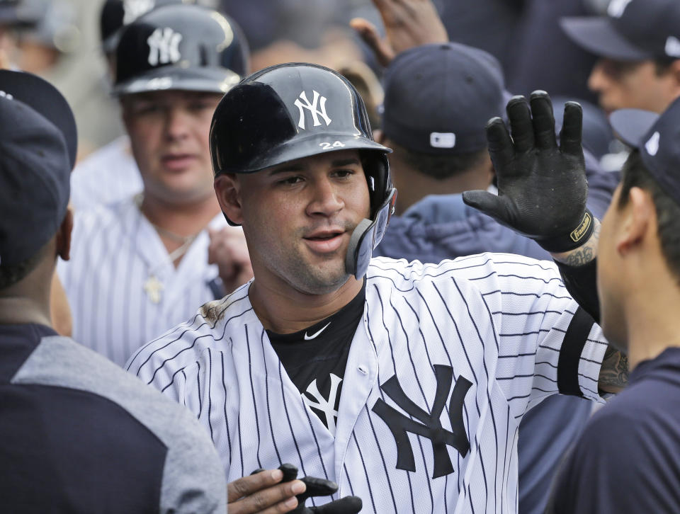 New York Yankees' Gary Sanchez celebrates with teammates after hitting a three-run homer during the first inning of a baseball game against the Tampa Bay Rays at Yankee Stadium, Wednesday, June 19, 2019, in New York. (AP Photo/Seth Wenig)