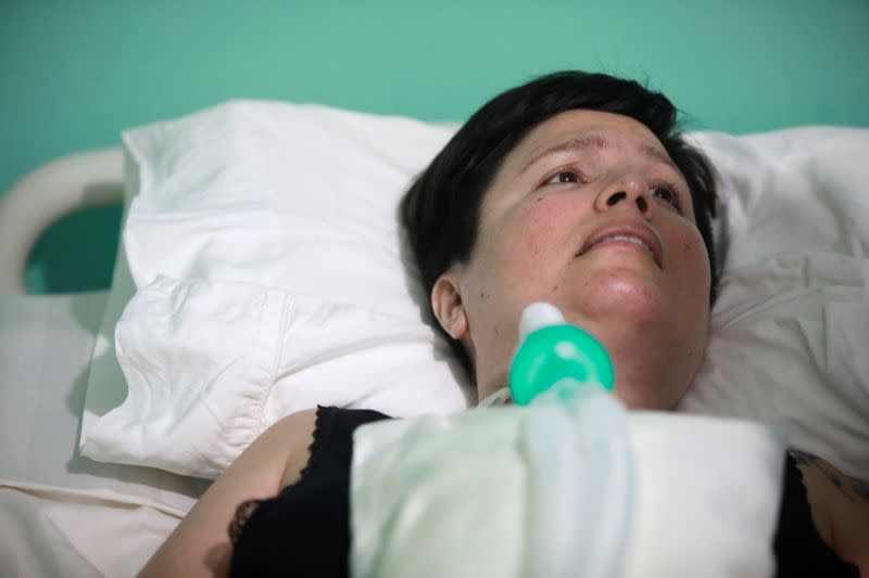 Ana Estrada, a euthanasia advocate who suffers from an incurable condition, lies in bed at her home in Lima