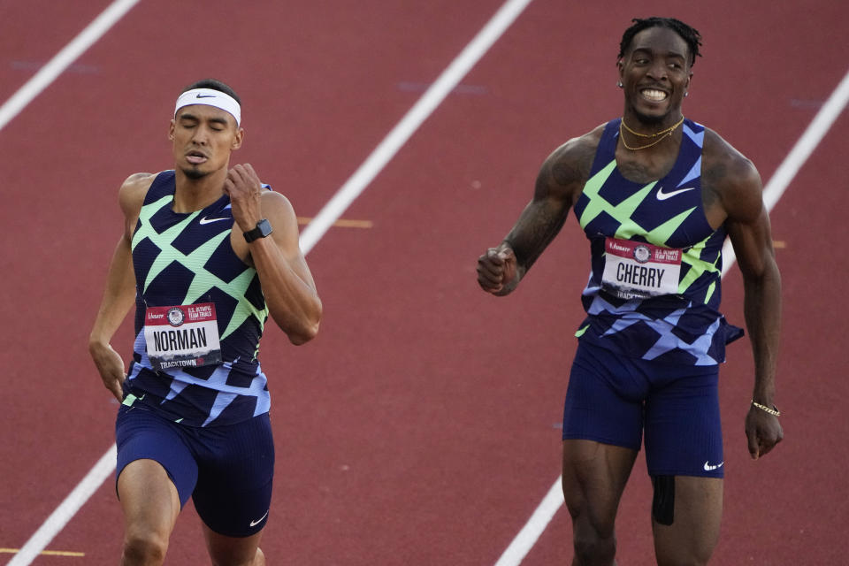 Winner, Michael Norman, left, and Michael Cherry, second, race in the men's 400-meter run at the U.S. Olympic Track and Field Trials Sunday, June 20, 2021, in Eugene, Ore. (AP Photo/Chris Carlson)