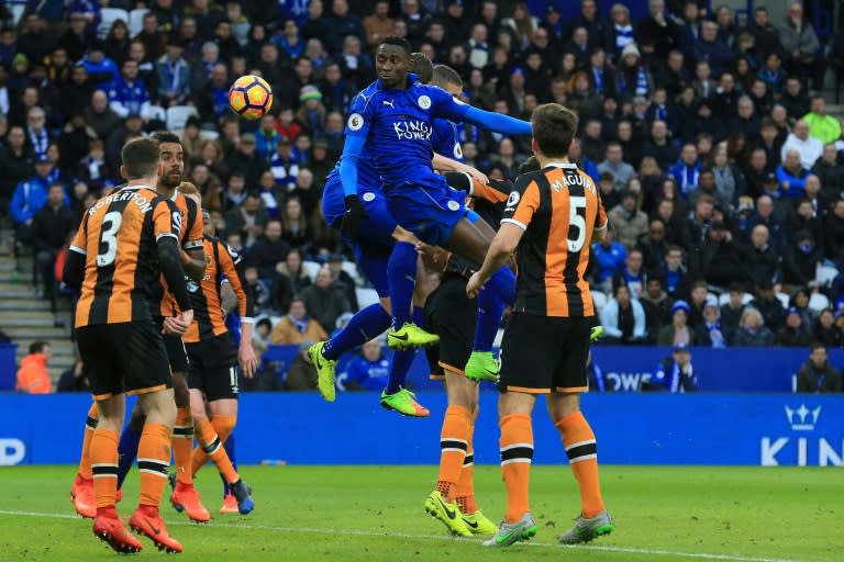 Leicester City's midfielder Wilfred Ndidi (C) scores with this header to make the score 3-1 (later given as an own goal) during the English Premier League football match against Hull City March 4, 2017