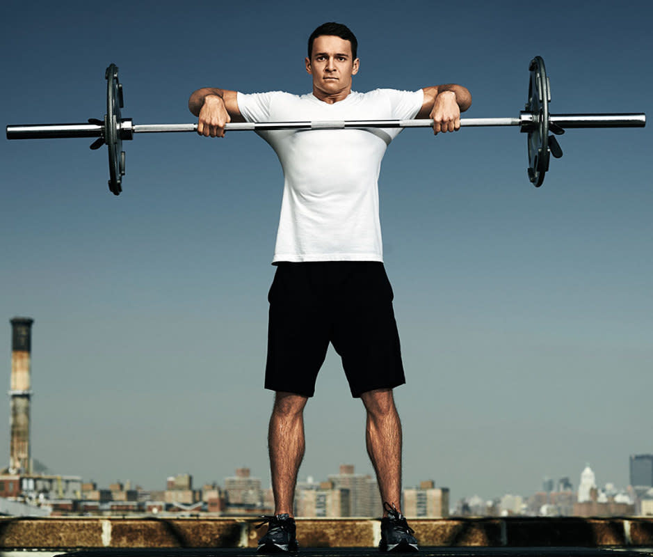 How to do it:<ul><li>Hold the bar with hands slightly farther outside shoulder width than for the overhead press.</li><li>Squeeze your shoulder blades together and pull the bar to chest height.</li><li>Your elbows should be bent 90 degrees in the top position and your upper arms should be horizontal.</li></ul>