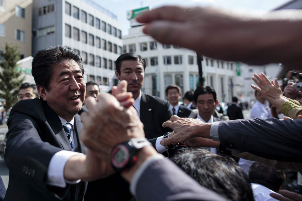 Image: Japan's Prime Minister Shinzo Abe greeting his supporters during an election campaign appearance in Saitama. (Behrouz Mehri / AFP - Getty Images)