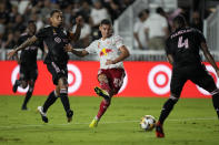 New York Red Bulls forward Patryk Klimala shoots while defended by Inter Miami midfielder Gregore Silva, left, and defender Christian Makoun during the first half of an MLS soccer match Friday, Sept. 17, 2021, in Fort Lauderdale, Fla. (AP Photo/Rebecca Blackwell)