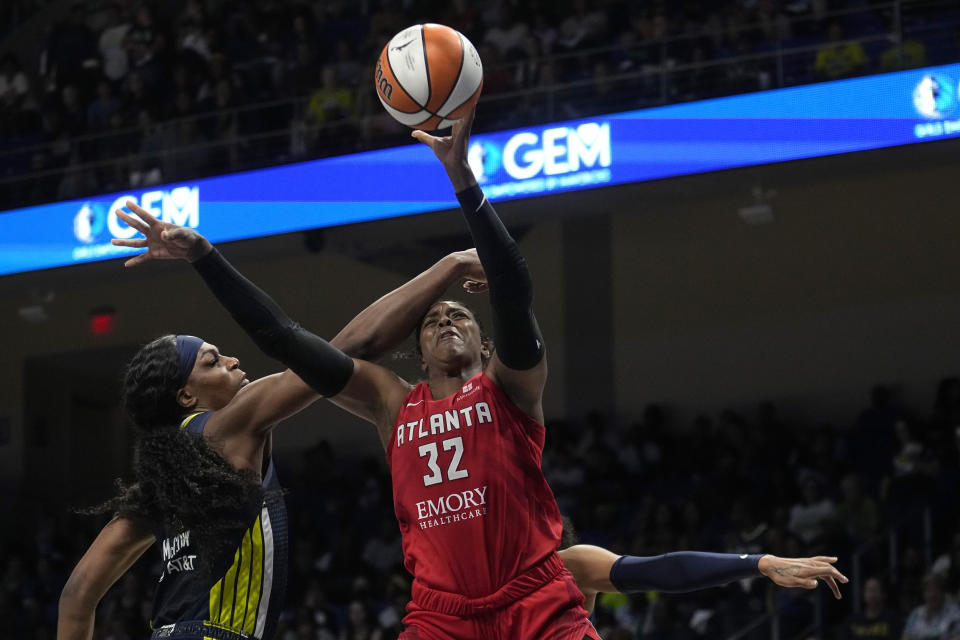 Atlanta Dream forward Cheyenne Parker (32) takes a shot as Dallas Wings center Teaira McCowan, left, defends in the first half of Game 2 of a first-round WNBA basketball playoff series, Tuesday, Sept. 19, 2023, in Arlington, Texas. (AP Photo/Tony Gutierrez)