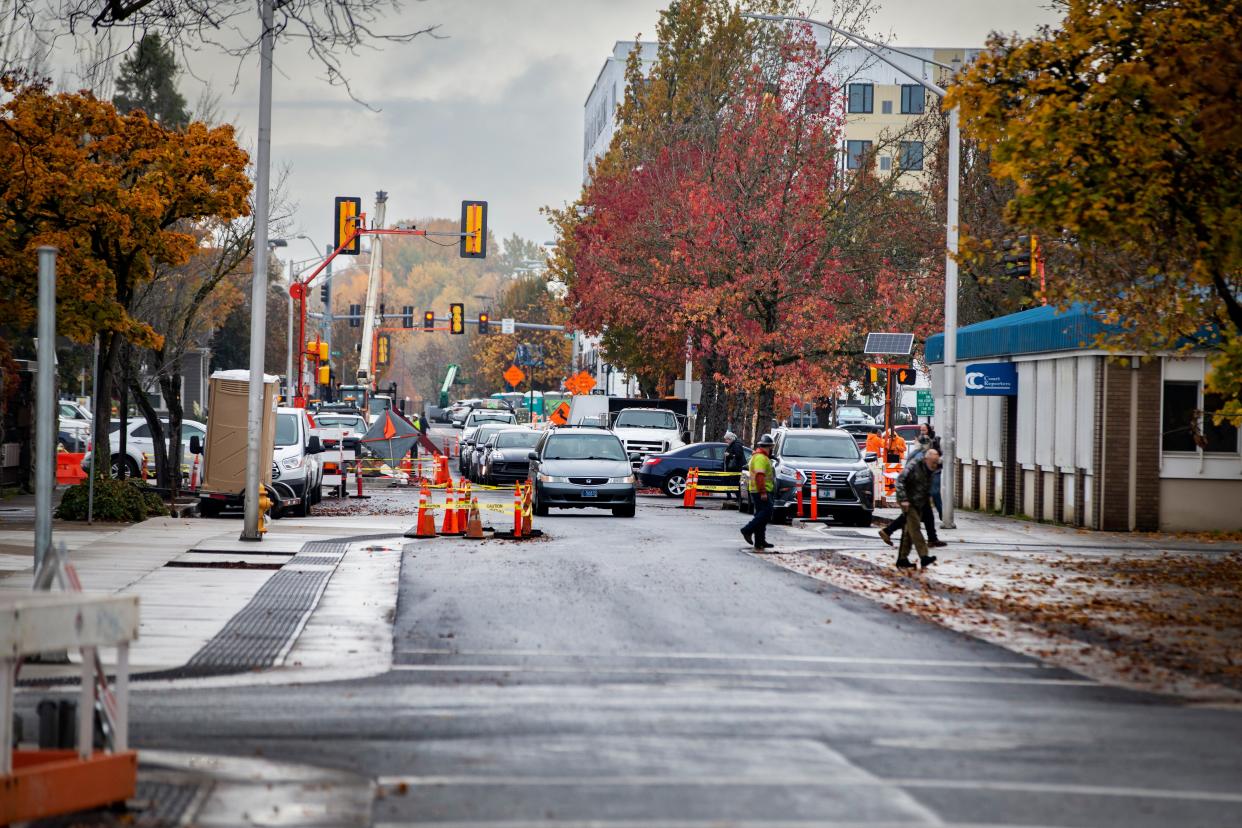The city of Eugene has been working to reconfigure East 8th Avenue between Mill Street and Lincoln Street to decrease traffic lanes, add protected bike lanes and widen sidewalks.