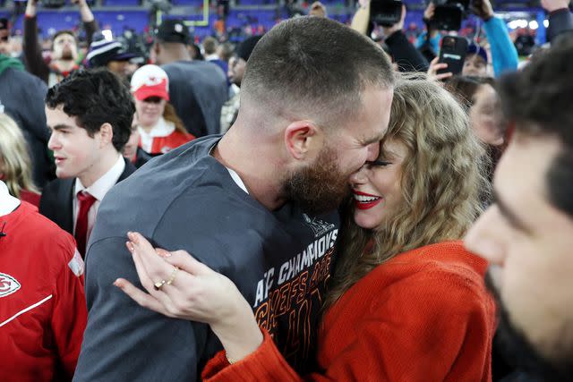 <p>Patrick Smith/Getty </p> Travis Kelce of the Kansas City Chiefs celebrates with Taylor Swift