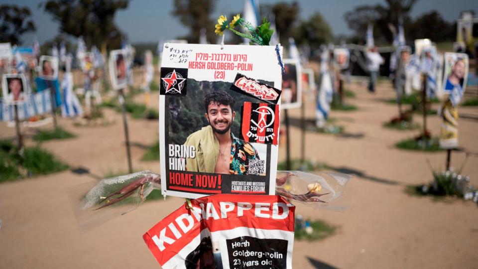 PHOTO: A poster depicting Israeli-American hostage Hersh Goldberg-Polin is displayed in Re'im, southern Israel at the Gaza border, Feb. 26, 2024, at a memorial site for the Nova music festival site. (Maya Alleruzzo/AP)