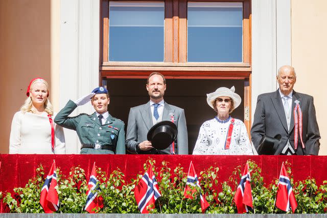 <p>Per Ole Hagen/Getty</p> (From left) Crown Princess Mette Marit, Princess Ingrid Alexandra, Crown Prince Haakon, Queen Sonja and King Harald greet the children's parade at the Royal Palace during the Norwegian National Day on May 17, 2024 in Oslo.