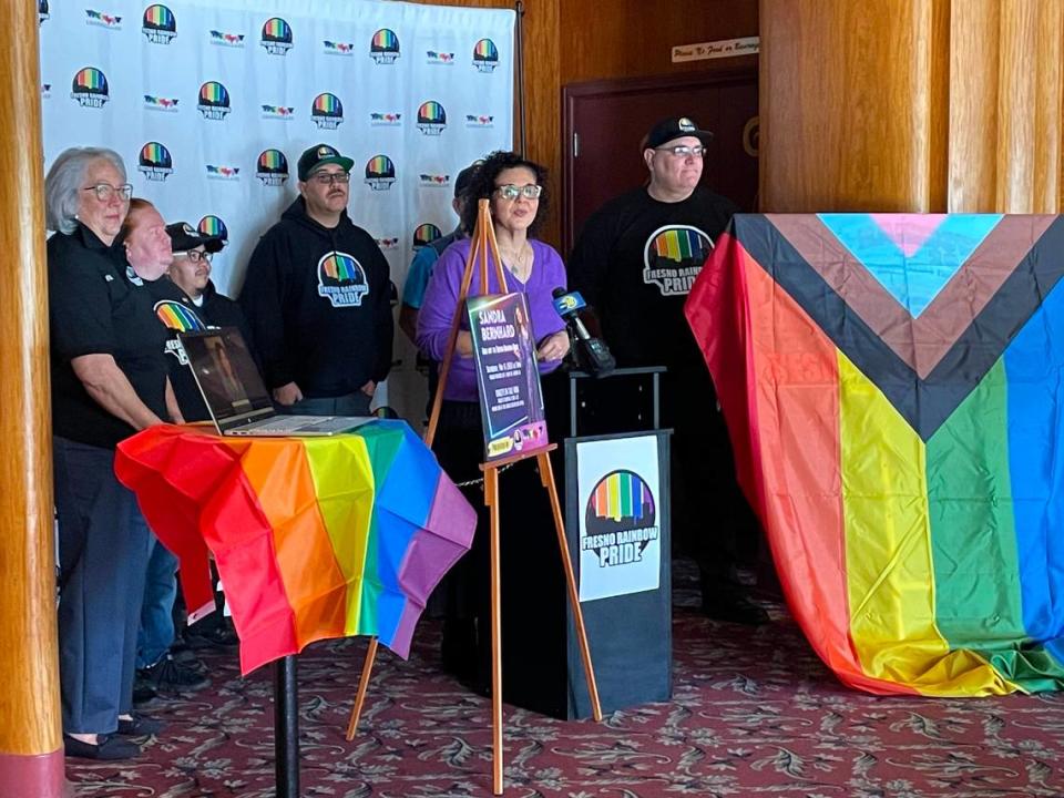 Organizers with Fresno Reel Pride inside the lobby at the Tower Theater unveil the theme and date for 2024’s festival and parade.