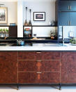 <p> Part of the trend towards less &#x2018;kitchen-y&#x2019; cooking spaces, classical&#xA0;wood kitchen cabinet ideas&#xA0;are making a move into the kitchen. &#x2018;Traditional timbers are being embraced in new and unexpected ways,&#x2019; says Katie Glaister of&#xA0;K&amp;H Design.&#xA0; </p> <p> &#x2018;For example, framing a beautifully book-matched&#xA0;kitchen island&#xA0;in burr walnut with aged brass accents recreates the look of an antique bureau but, elevated on legs, it feels less cumbersome and more modern.&#x2019; </p>