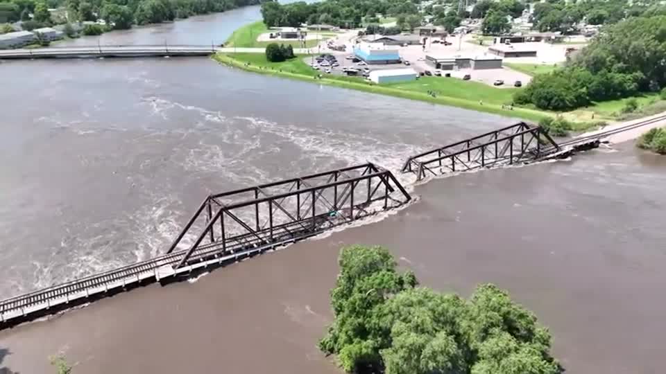 Record-breaking water levels in the Big Sioux River caused the collapse of a BNSF railroad bridge between North Sioux City in South Dakota and the Riverside neighborhood of Sioux City late Sunday, June 24, 2024.