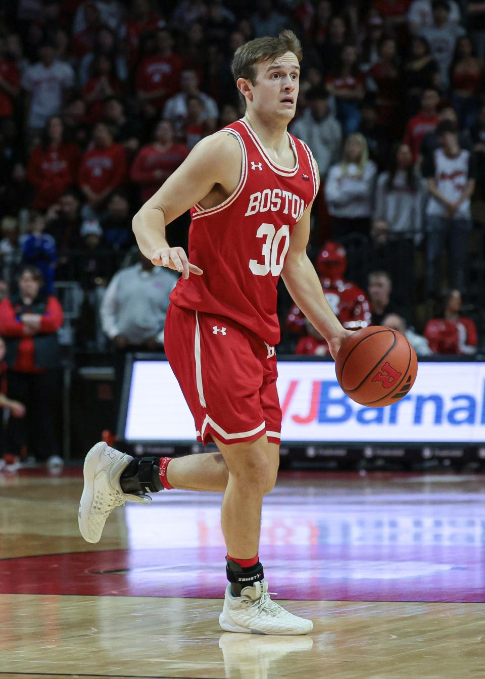 Nov 10, 2023; Piscataway, New Jersey, USA; Boston University Terriers guard Ben Roy (30) dribbles during the first half against the Rutgers Scarlet Knights at Jersey Mike's Arena.