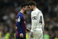 FILE - In this March 2, 2019 file photo, Barcelona forward Lionel Messi, left, goes head to head with Real defender Sergio Ramos as they argue during the Spanish La Liga soccer match between Real Madrid and FC Barcelona at the Bernabeu stadium in Madrid. The Spanish football league on Wednesday Oct. 16. 2019, has asked the Spanish football federation to change the location of the match between Barcelona and Real Madrid to avoid it coinciding with plans for a separatist rally. The league wants the federation to shift the match to Madrid. (AP Photo/Manu Fernandez, File)