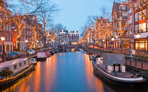 Amsterdam's canals have added glitz at Christmas time - Credit: iStock