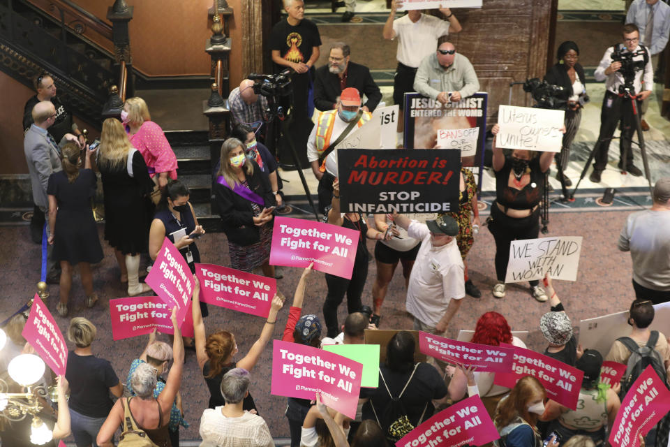 Protesters who support more abortion restrictions and protestors who upset at the recent U.S. Supreme Court ruling removing protections for abortions demonstrate in the lobby of the South Carolina Statehouse on Tuesday, June 28, 2022, in Columbia South Carolina. (AP Photo/Jeffrey Collins)