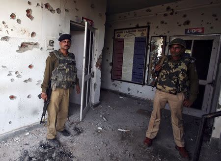 Indian security personnel stand guard after an attack on a police camp at Kathua district, south of Jammu March 20, 2015. REUTERS/Mukesh Gupta