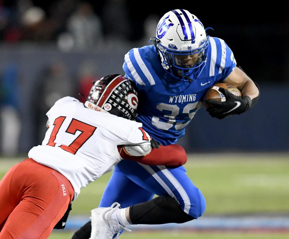 Glenville's Jermaine Agee brings down Wyoming's CJ Hester in the OHSAA Division Iv State Championship football game at Tom Benson Hall of Fame Stadium. Saturday, December 03, 2022. 