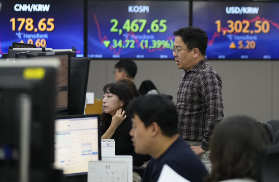 Currency traders watch monitors at the foreign exchange dealing room of the KEB Hana Bank headquarters in Seoul, South Korea, Tuesday, Nov. 7, 2023. Shares mostly fell in Asia on Tuesday after a mixed close on Wall Street, where wild recent moves calmed a bit at the beginning of a quiet week for data releases. (AP Photo/Ahn Young-joon)
