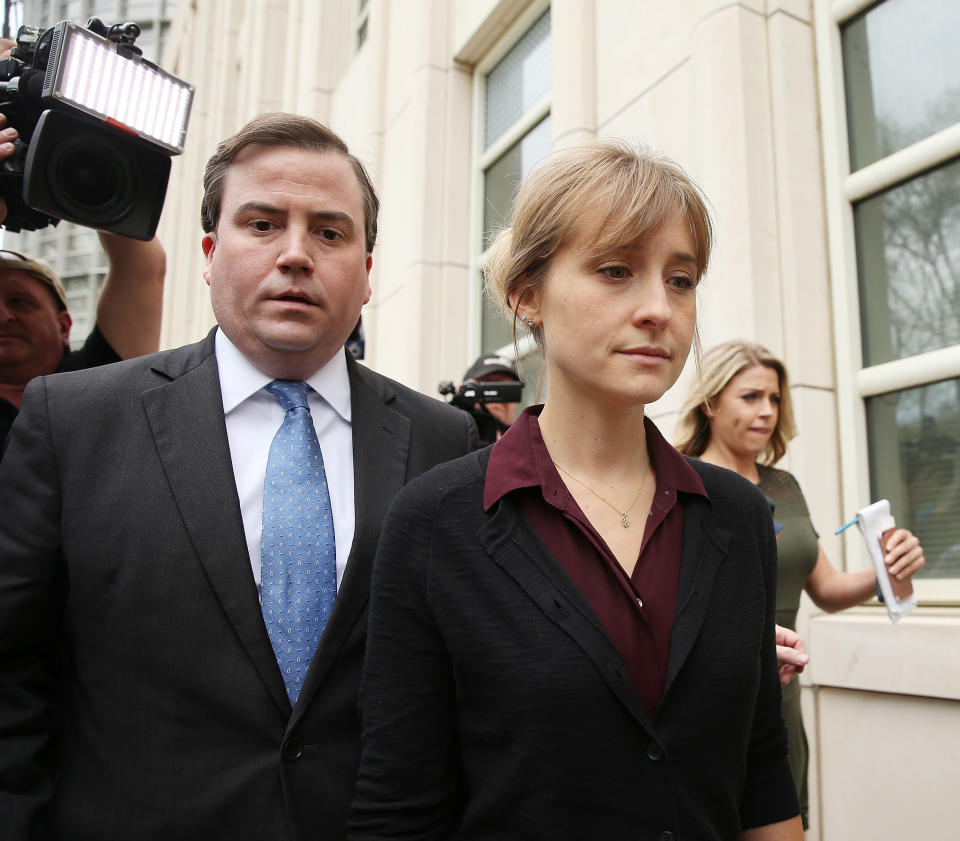 NEW YORK, NY - MAY 04:  Actress Allison Mack (R) departs the United States Eastern District Court after a bail hearing in relation to the sex trafficking charges filed against her on May 4, 2018 in the Brooklyn borough of New York City. The actress known for her role on 'Smallville' is charged with sex trafficking. Along with alleged cult leader Keith Raniere, prosecutors say Mack recruited women to an upstate New york mentorship group NXIVM that turned them into sex slaves.  (Photo by Jemal Countess/Getty Images)