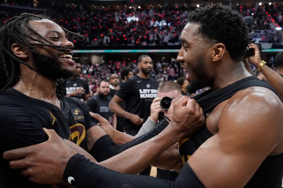 Cleveland Cavaliers’ <a class="link " href="https://sports.yahoo.com/nba/players/6167/" data-i13n="sec:content-canvas;subsec:anchor_text;elm:context_link" data-ylk="slk:Darius Garland;sec:content-canvas;subsec:anchor_text;elm:context_link;itc:0">Darius Garland</a>, left, and <a class="link " href="https://sports.yahoo.com/nba/players/5826/" data-i13n="sec:content-canvas;subsec:anchor_text;elm:context_link" data-ylk="slk:Donovan Mitchell;sec:content-canvas;subsec:anchor_text;elm:context_link;itc:0">Donovan Mitchell</a> celebrate after defeating the Orlando Magic in Game 7 of an NBA basketball first-round playoff series, Sunday, May 5, 2024, in Cleveland. (AP Photo/Sue Ogrocki)
