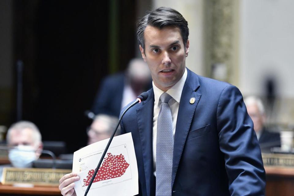 Kentucky Senator Morgan McGarvey holds a state map showing infection rate of COVID-19 among Kentucky counties during the opening day of the Kentucky State Legislature special session in Frankfort, Ky., Tuesday, Sept. 7, 2021. (AP Photo/Timothy D. Easley, File)