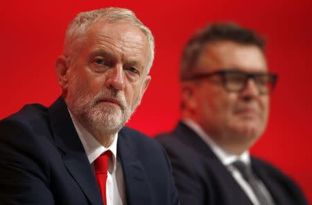 The Leader of Britain's opposition Labour Party, Jeremy Corbyn (L), and deputy leader, Tom Watson, listen to a speech on the first day of the Labour Party conference, in Liverpool, Britain September 25, 2016. REUTERS/Peter Nicholls