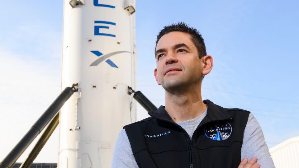 Jared Isaacman, the founder and chief executive officer of Shift4 Payments, stands for a portrait in front of the recovered first stage of a Falcon 9 rocket at SpaceX headquarters in California on February 2, 2021. Isaacman's all-civilian Inspiration4 mission raised more than $250 million for St. Jude Children's Research Hospital. - Patrick T. Fallon/AFP/Getty Images