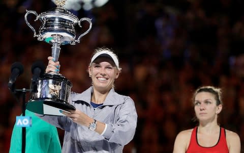 Wozniacki with the Australian Open trophy - Credit: AP