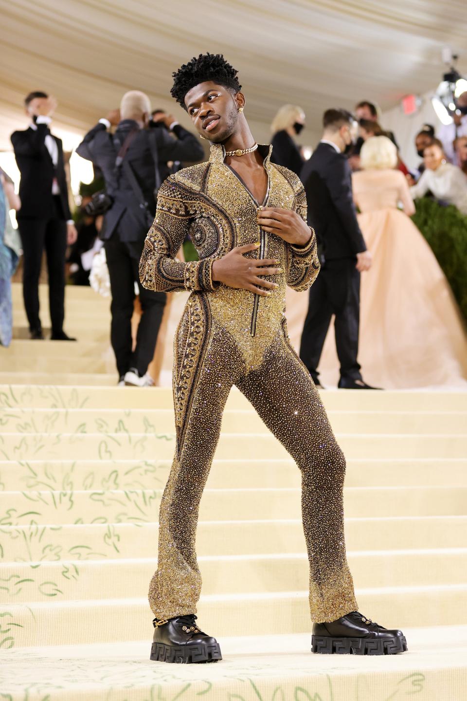 Lil Nas X's star scintillates brighter and brighter with each passing day, whether it's pulling off several different sexy, shocking looks at the Met Gala (like the one pictured).