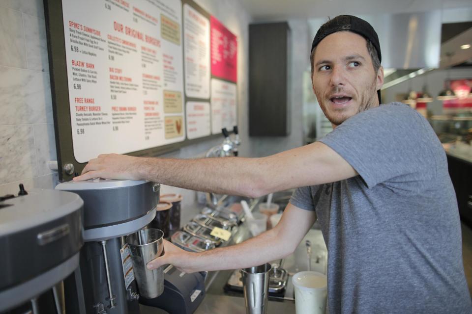 In this May 7, 2012 photo, "Top Chef" star Spike Mendelsohn prepares the "AP Milkshake" at his new Good Stuff Eatery restaurant in Crystal City, Arlington, Va. (AP Photo/Charles Dharapak)