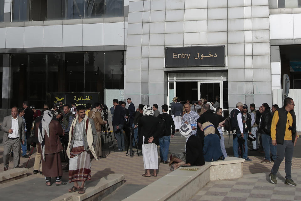 Yemenis gather at Sanaa airport, Yemen, Monday, May, 16, 2022. The first commercial flight in six years took off from Yemen’s rebel-held capital on Monday, officials said, part of a fragile truce in the county’s grinding civil war.(AP Photo/Hani Mohammed)