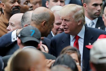 U.S. Republican presidential candidate Donald Trump and U.S. Secretary of Homeland Security Jeh Johnson attend ceremonies to mark the 15th anniversary of the September 11 attacks at the National 9-11 Memorial in New York, United States September 11, 2016. REUTERS/Brian Snyder