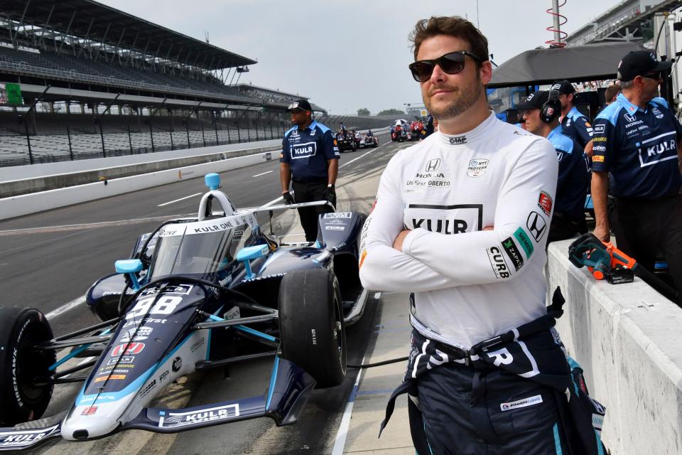 Andretti Herta Autosport with Marco Andretti and Curb-Agajanian driver Marco Andretti (98) stands by his car Friday, May 19, 2023, during Fast Friday ahead of the 107th running of the Indianapolis 500 at Indianapolis Motor Speedway. 