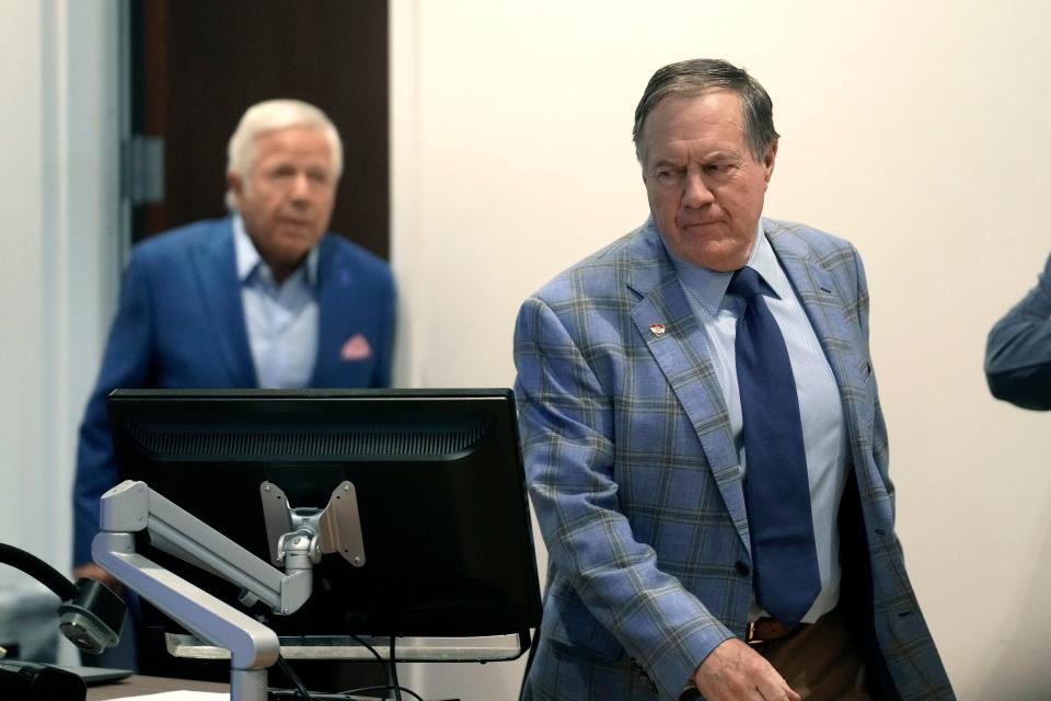 Former New England Patriots head coach Bill Belichick, right, and Patriots owner Robert Kraft, left, arrive for an NFL football news conference, Thursday, Jan. 11, 2024, in Foxborough, Mass., to announce that Belichick, a six-time NFL champion, has agreed to part ways with the team. (AP Photo/Steven Senne)