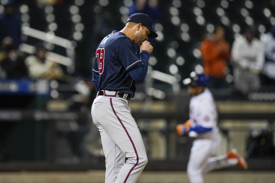 Atlanta Braves relief pitcher Jay Flaa (78) reacts as New York Mets' Francisco Lindor runs the bases after hitting a two-run home run during the seventh inning of a baseball game Saturday, May 29, 2021, in New York. (AP Photo/Frank Franklin II)