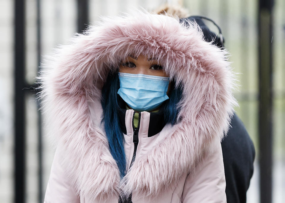 Is your coat covered in COVID-19? (No, probably not). (Photo: Andrew Chin via Getty Images)