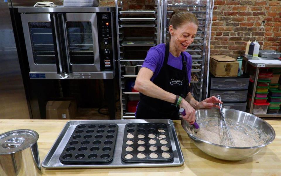 Tracy St. John makes a fresh batch of dog treats Friday morning at Three Dog Bakery, at 1106 Broadway in downtown Columbus, Georgia. Three Dog Bakery offers fresh baked treats made in-house. 04/19/2024 Mike Haskey/mhaskey@ledger-enquirer.com