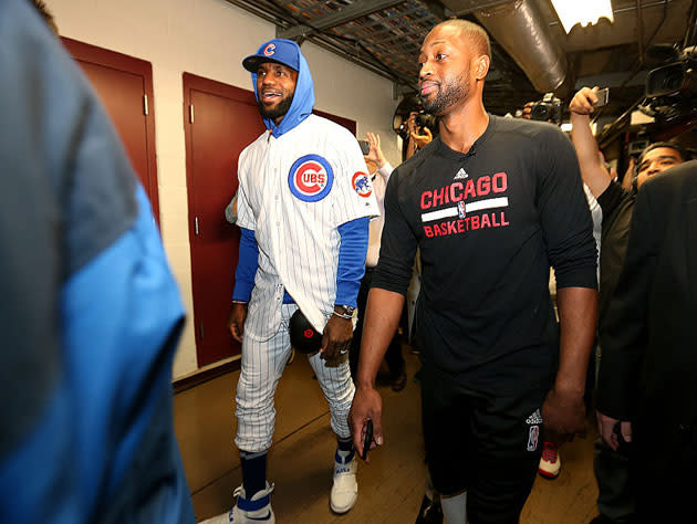 LeBron James and Dwyane Wade make their way into work. (Getty Images)