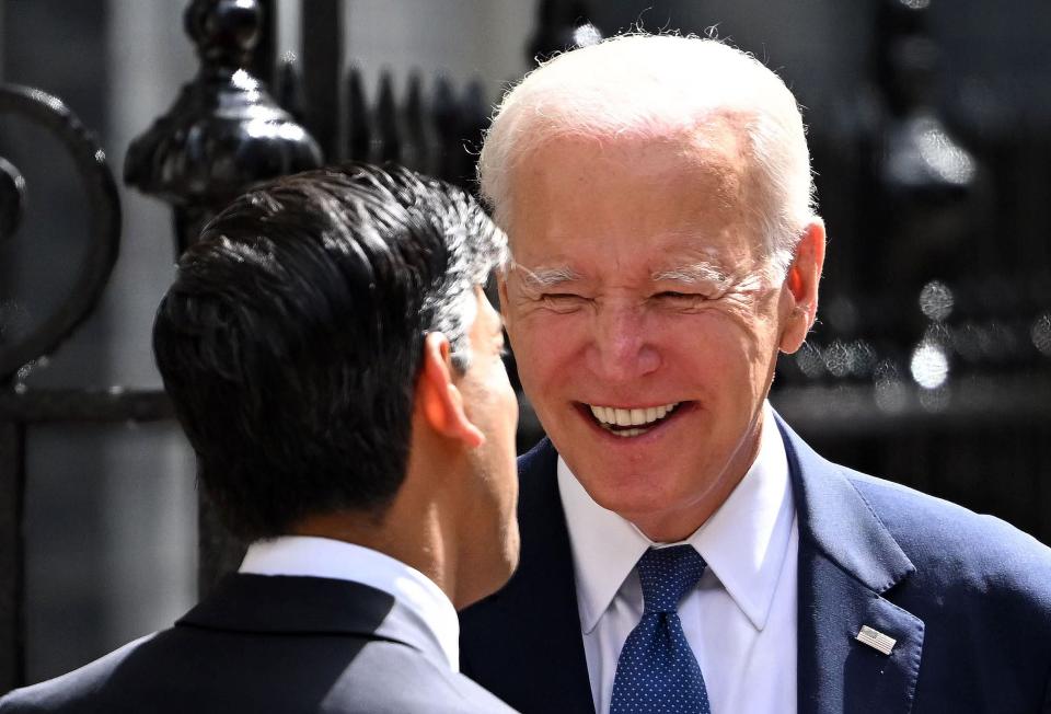 Britain's Prime Minister Rishi Sunak greets US President Joe Biden outside of 10 Downing Street (AFP via Getty Images)