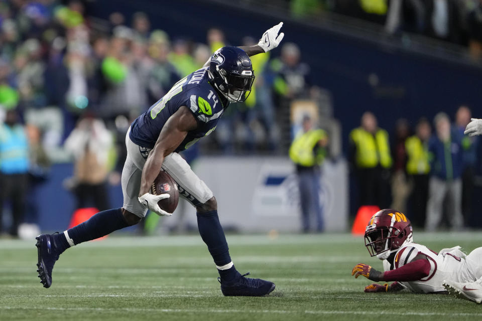 Seattle Seahawks wide receiver DK Metcalf (14) celebrates in the second half of an NFL football game against the Washington Commanders in Seattle, Sunday, Nov. 12, 2023. (AP Photo/Lindsey Wasson)