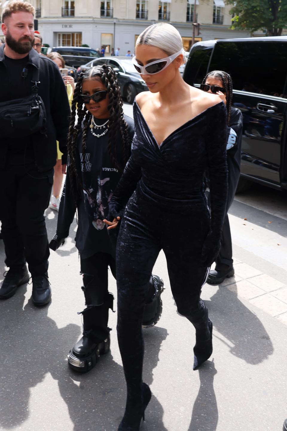 <p>West looked ultra cool at the Balenciaga couture show in an all-black look, consisting of a long-sleeve oversized shirt, threaded jeans, and the Balenciaga x Crocs platform sandals.</p>