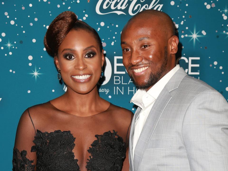 Issa Rae and Louis Diame posing together at an event in February 2017.