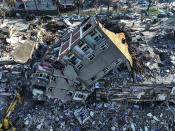 Aerial photo shows the destruction in Kahramanmaras, southern Turkey, Wednesday, Feb. 8, 2023. Thinly stretched rescue teams worked through the night in Turkey and Syria, pulling more bodies from the rubble of thousands of buildings toppled by a catastrophic earthquake. The death toll rose Wednesday to more than 9,500, making the quake the deadliest in more than a decade. (Ahmet Akpolat/DIA via AP )