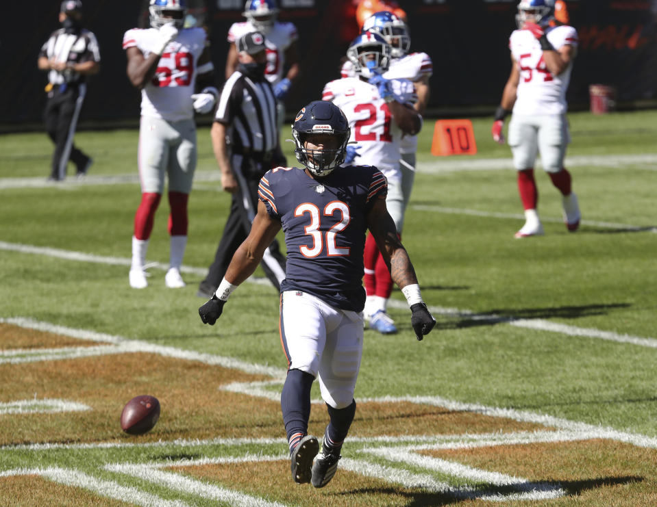 Chicago Bears running back David Montgomery (32) celebrates after rushing for a touchdown in the first quarter of an NFL football game against the New York Giants, Sunday, Sept. 20, 2020, in Chicago. (John J. Kim/Chicago Tribune via AP)