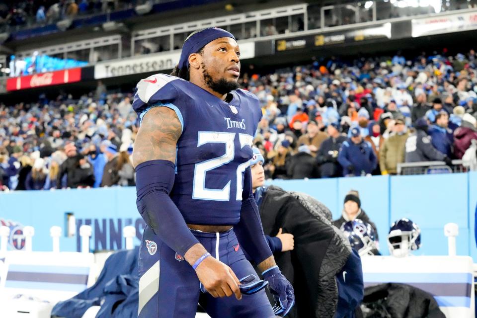 Tennessee Titans running back Derrick Henry (22) leaves the field after losing to the Bengals during the AFC divisional playoff game at Nissan Stadium Saturday, Jan. 22, 2022 in Nashville, Tenn. 