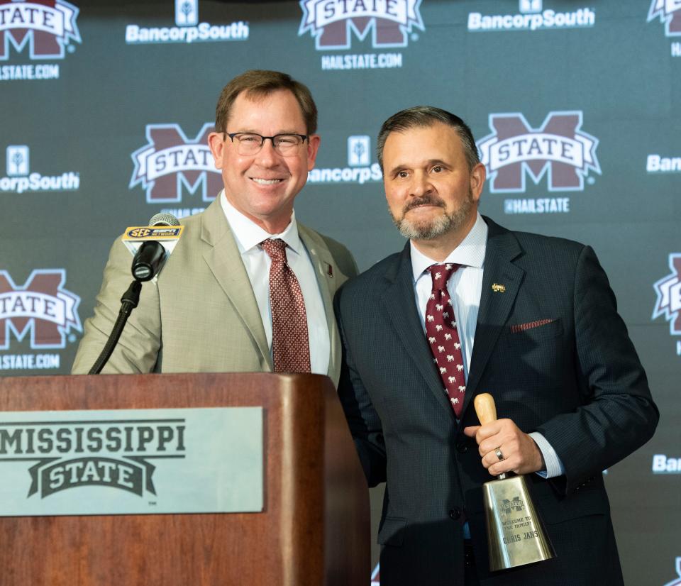 Mississippi State Athletic Director John Cohen, left, introduces new MSU basketball coach Chris Jans, right, during a news conference at MSU in Starkville Wednesday. March 23, 2022. 